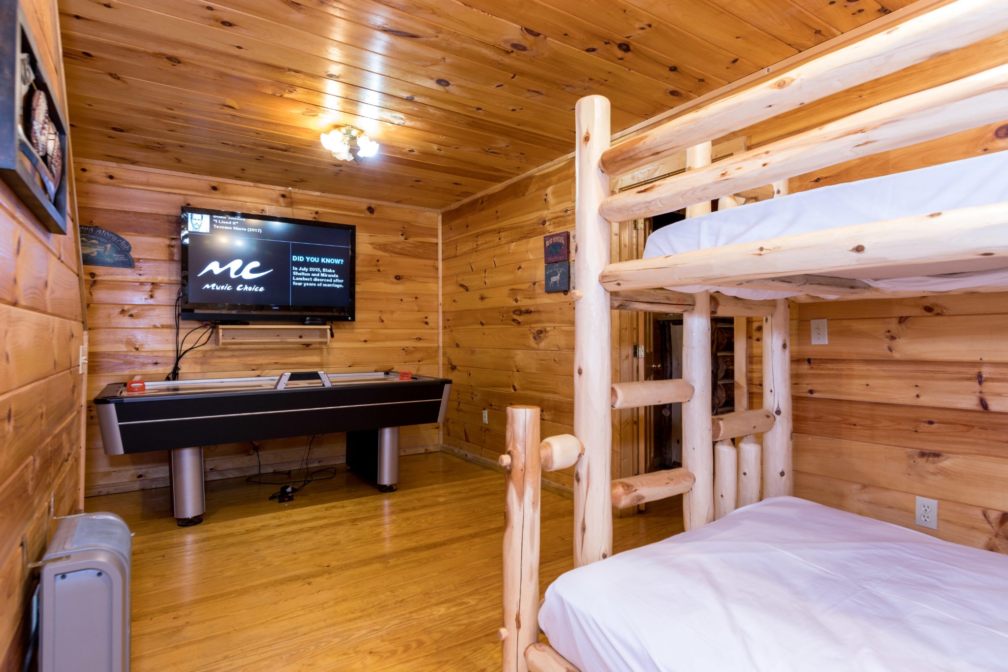 2036 Ridge Road, Unit 7 Sevierville, TN 37863 - Photo 18 of 23 a bedroom with a bed and a flat screen tv