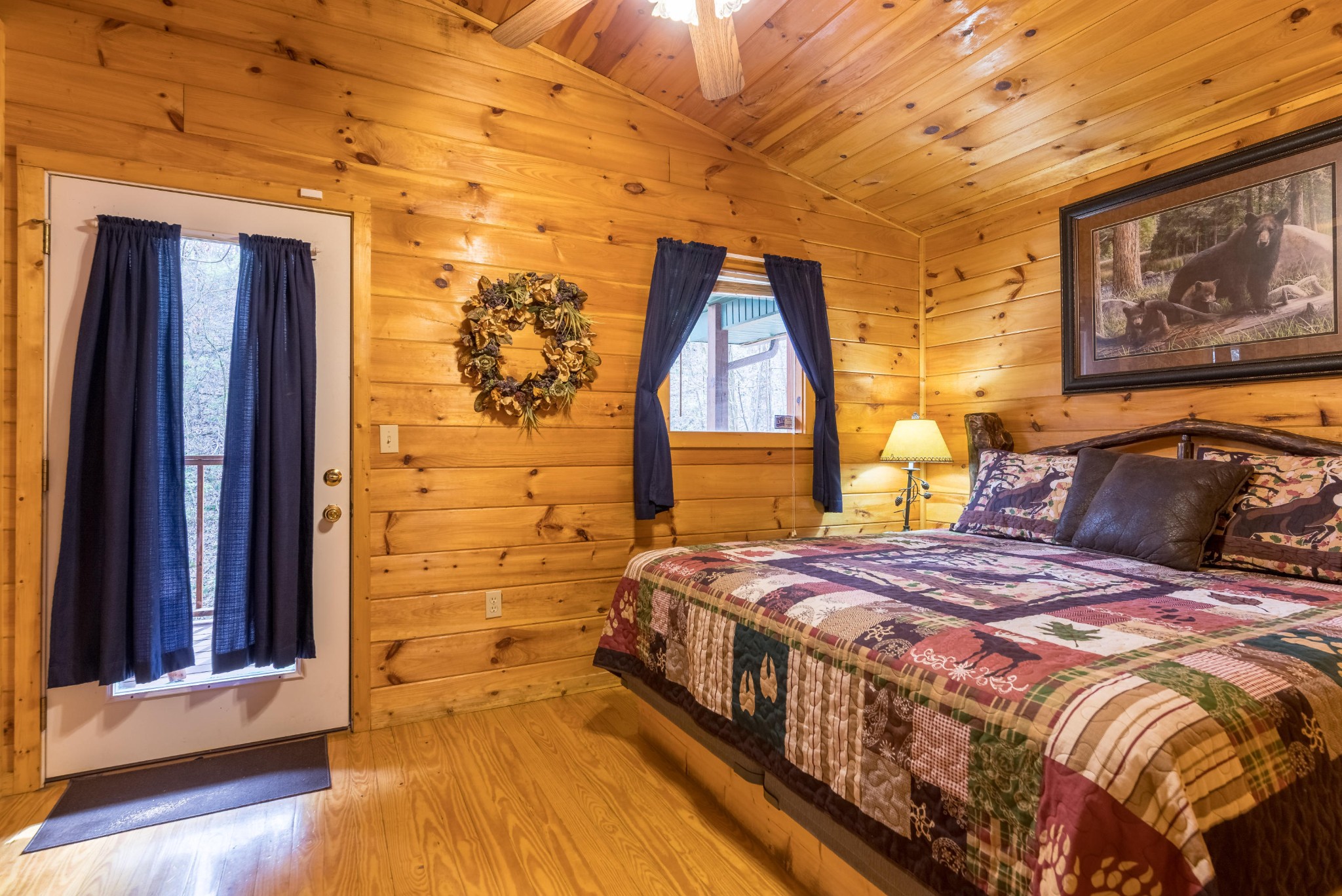 2036 Ridge Road, Unit 7 Sevierville, TN 37863 - Photo 20 of 23 a bedroom with a bed and wooden floor
