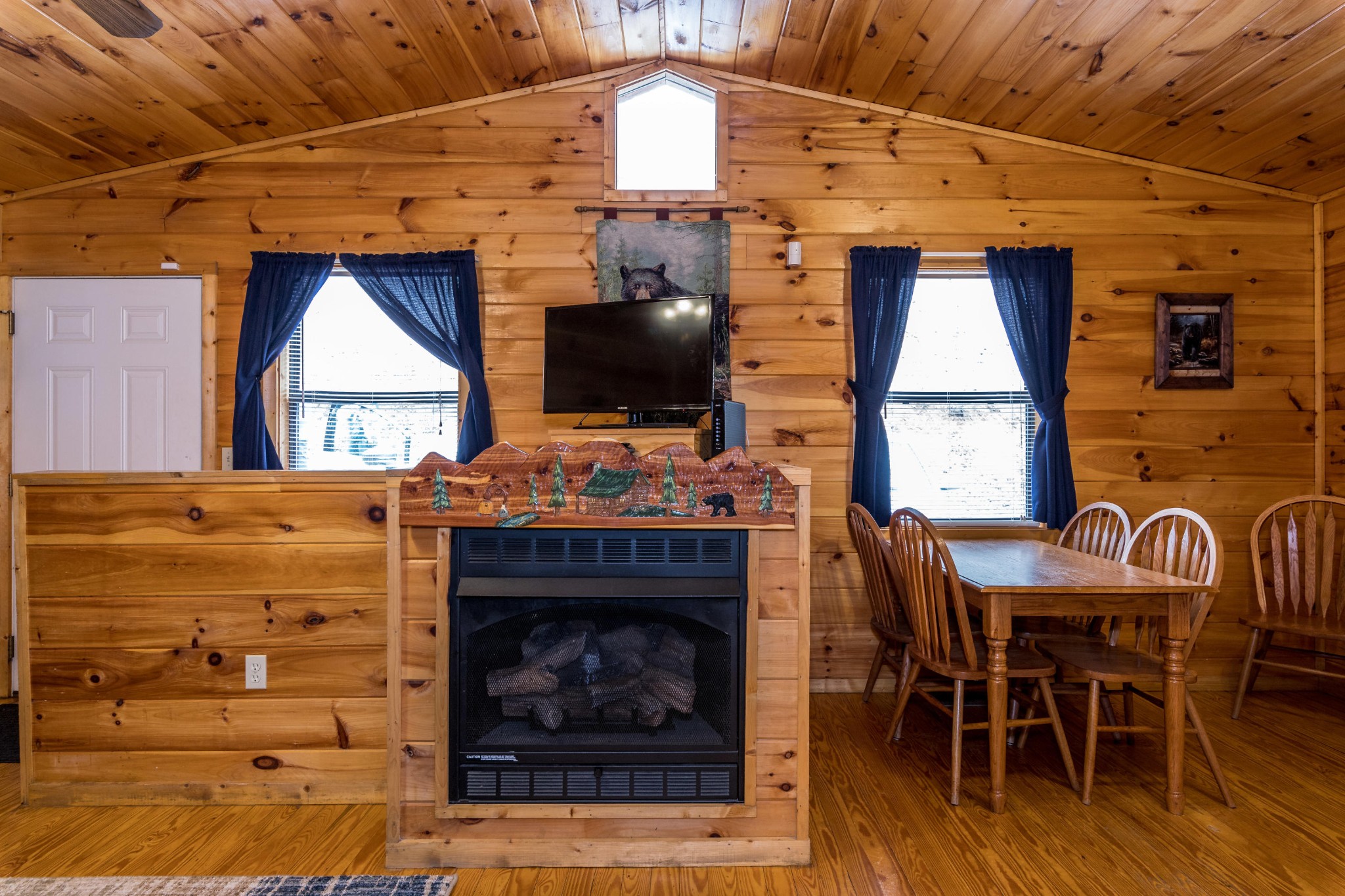 2036 Ridge Road, Unit 7 Sevierville, TN 37863 - Photo 9 of 23 a dining room with a fireplace wooden floor and a window