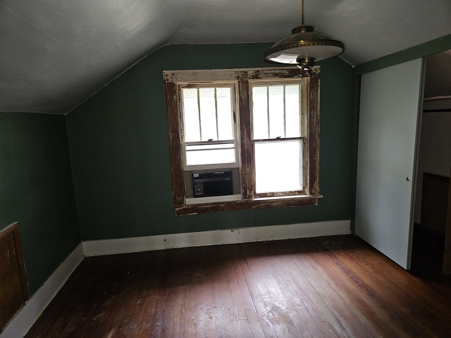 402 East 5th Street Flora, IL 62839 - Photo 23 of 29 a view of an empty room with wooden floor and a window