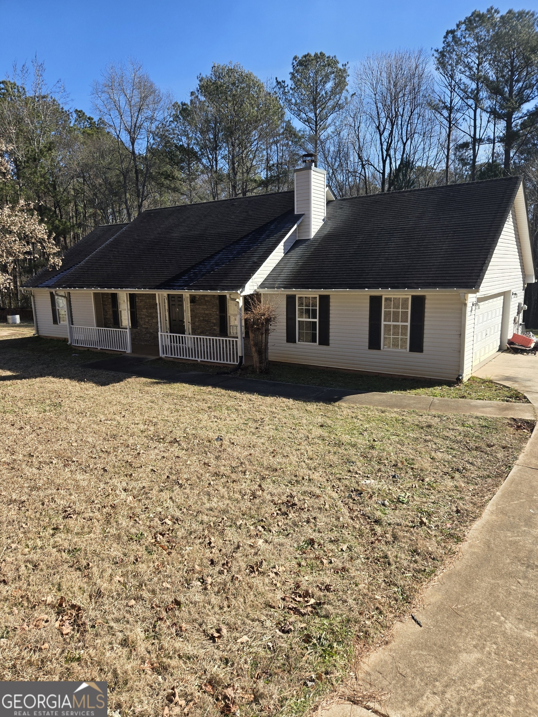 263 Rocky Point Road Covington, GA 30014 - Photo 1 of 1 a front view of a house with a yard