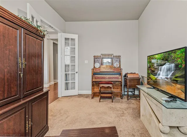 a reading room with furniture and a window