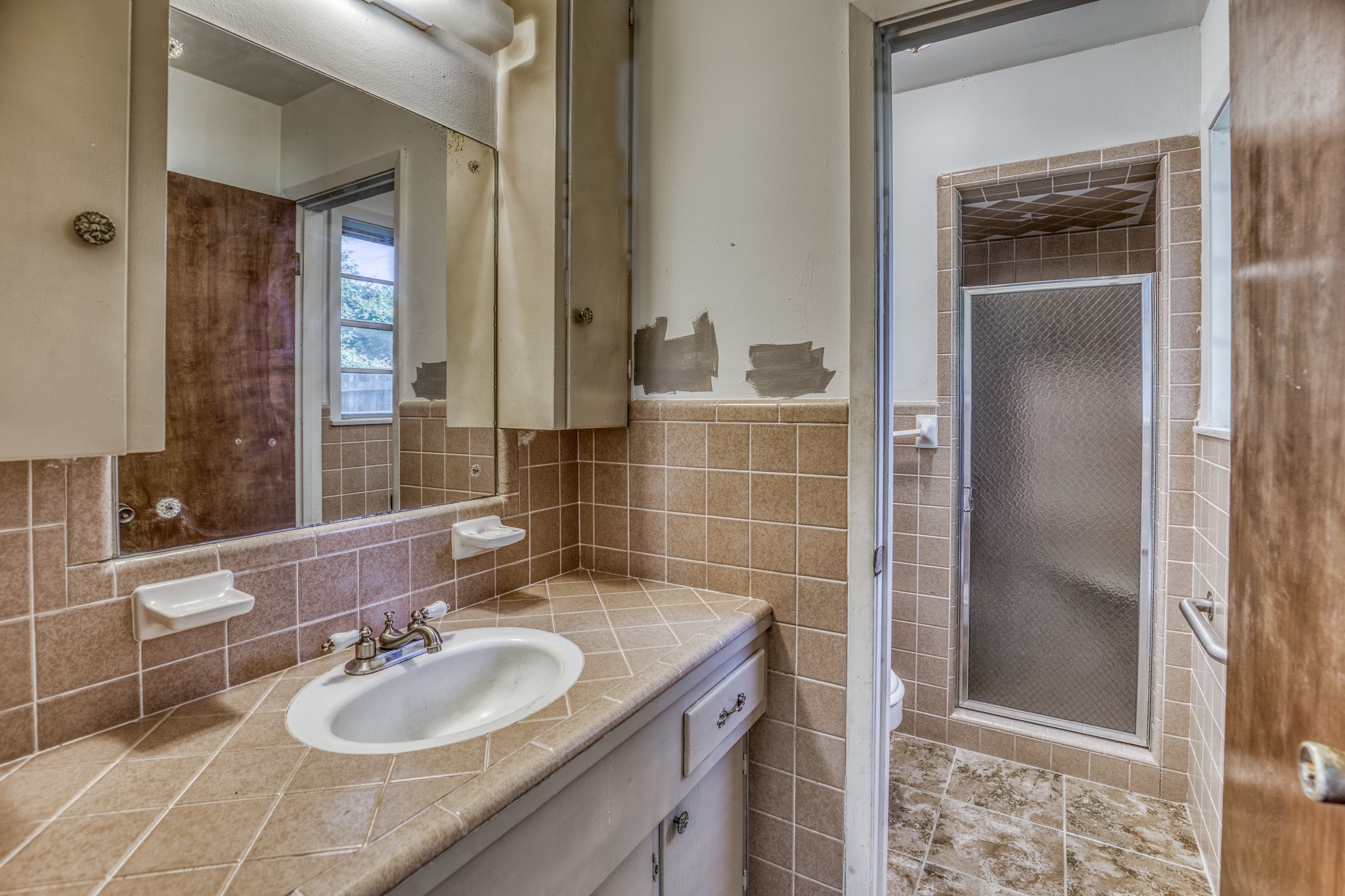 1687 Eagle Lake Road Sealy, TX 77474 - Photo 23 of 27 a bathroom with a sink and a mirror