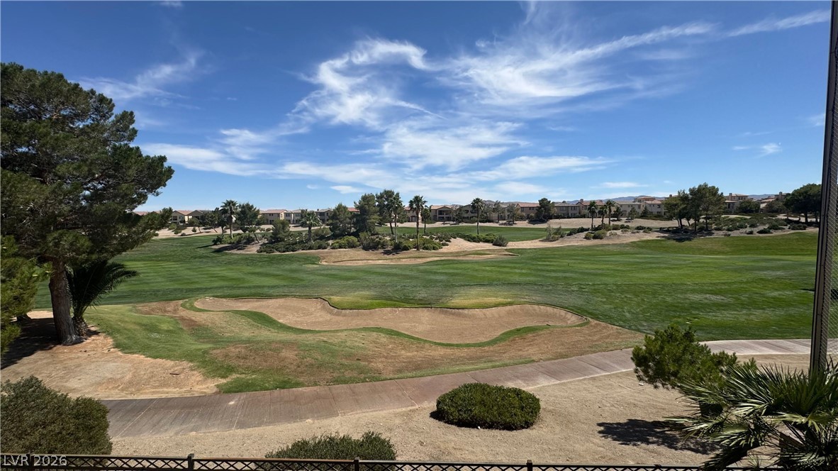 87 Tall Ruff Drive Las Vegas, NV 89148 - Photo 36 of 71 Vast golf course panorama with lush fairways and distant desert landscaping under an open sky.