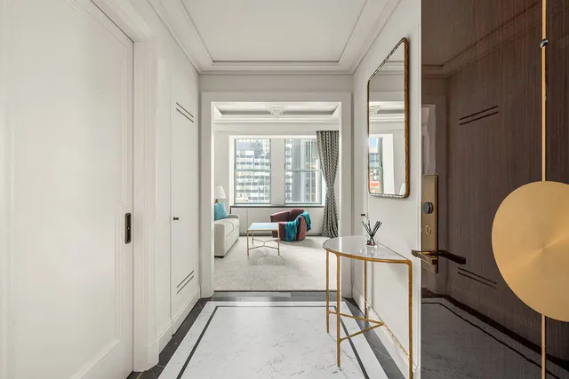 a view of a livingroom with furniture and a window