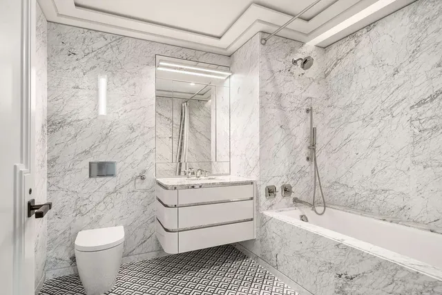 a bedroom with bed and a large window