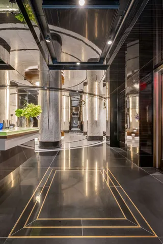 a large room with lots of chairs and chandelier