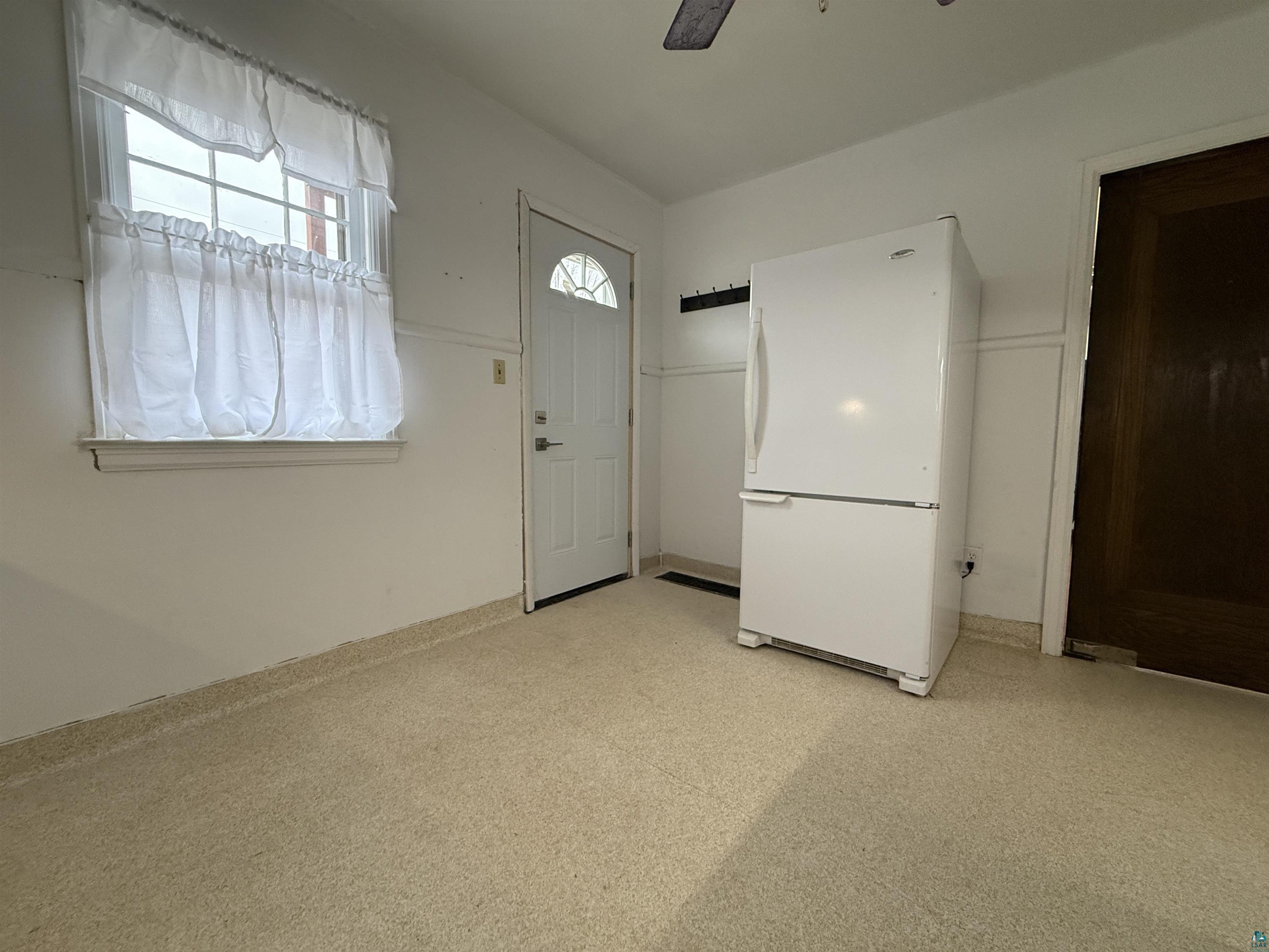 3001 3rd Avenue West Hibbing, MN 55746 - Photo 17 of 38 Entryway featuring light colored carpet and a ceiling fan