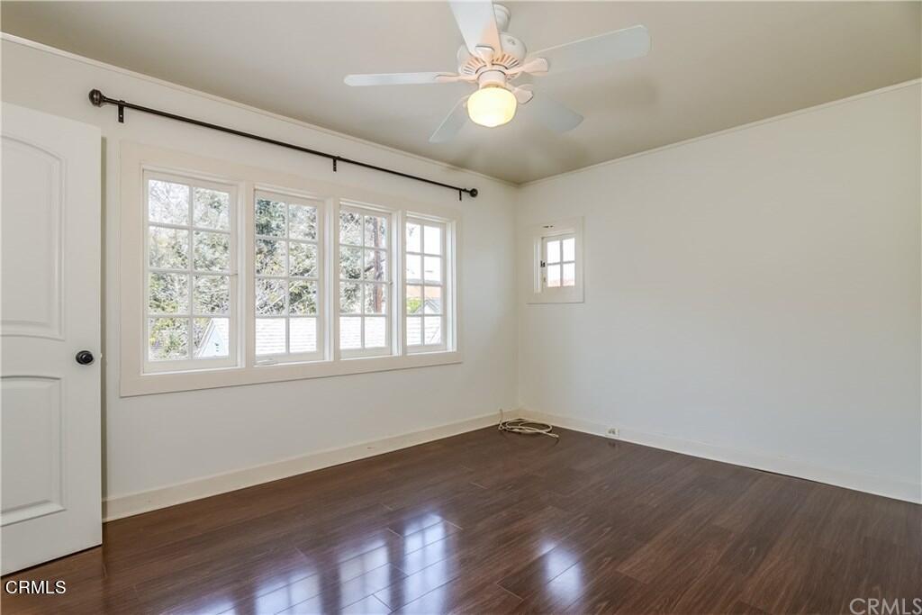 833 Oakwood Place Pasadena, CA 91106 - Photo 12 of 15 an empty room with wooden floor and windows