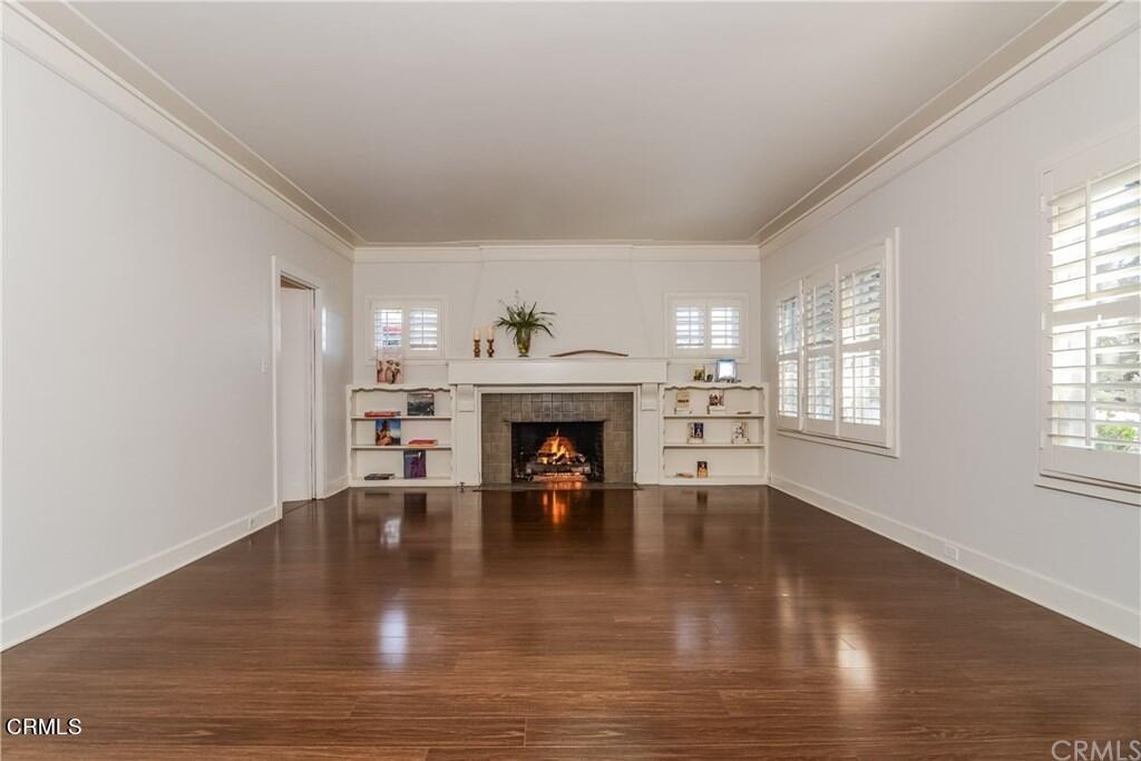 833 Oakwood Place Pasadena, CA 91106 - Photo 4 of 15 a view of an empty room with window and fire place
