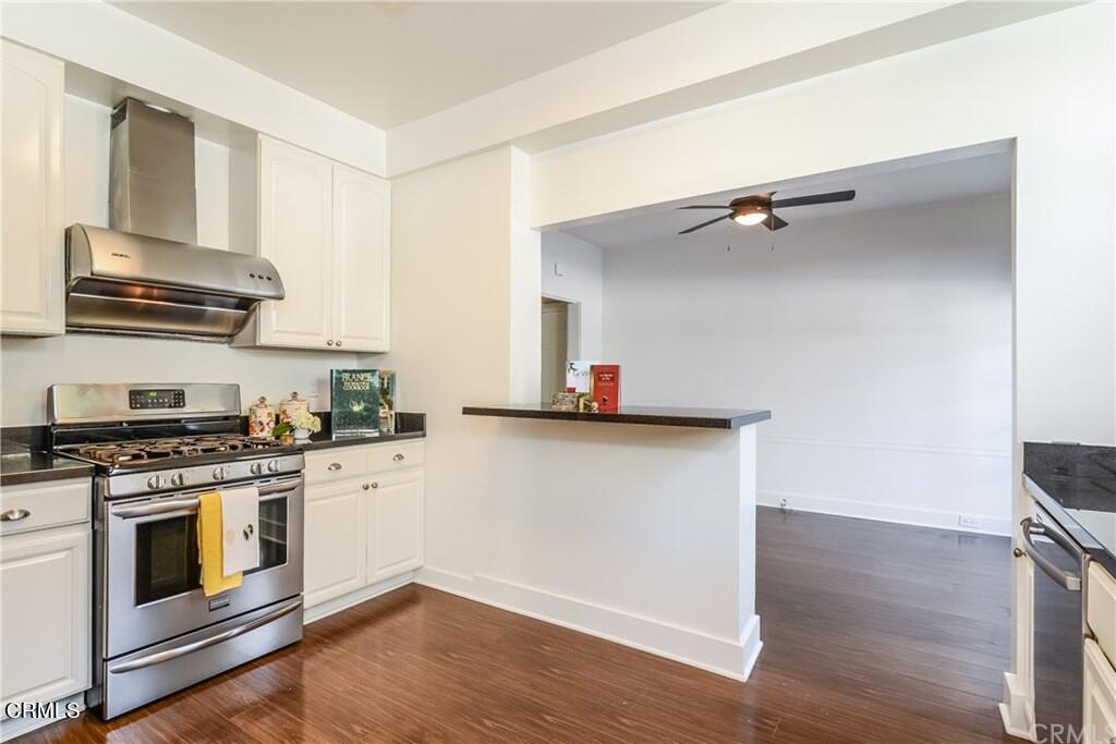 833 Oakwood Place Pasadena, CA 91106 - Photo 6 of 15 a kitchen with cabinets wooden floor and a sink