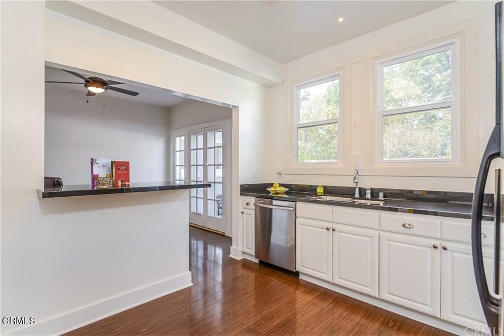 833 Oakwood Place Pasadena, CA 91106 - Photo 7 of 15 a kitchen with granite countertop a sink cabinets and wooden floor