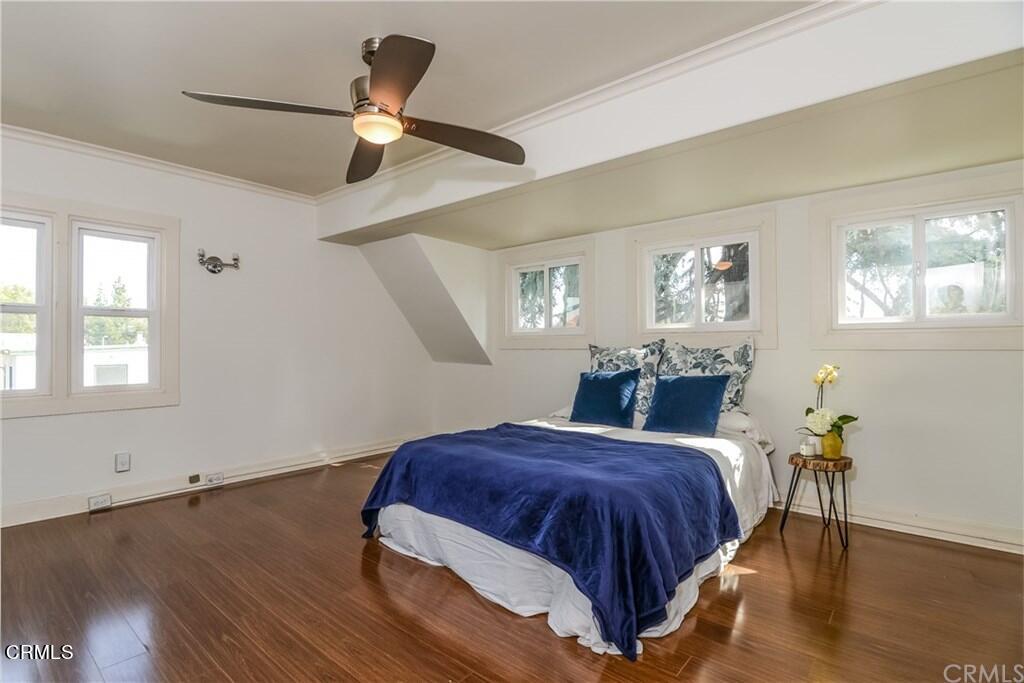 833 Oakwood Place Pasadena, CA 91106 - Photo 10 of 15 a spacious bedroom with a bed and wooden floor