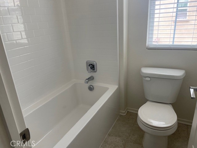 130 Citron Court Perris, CA 92571 - Photo 14 of 32 a white toilet sitting next to a bath tub