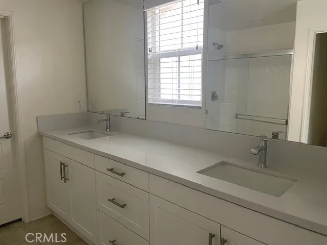 a bathroom with a sink and a window
