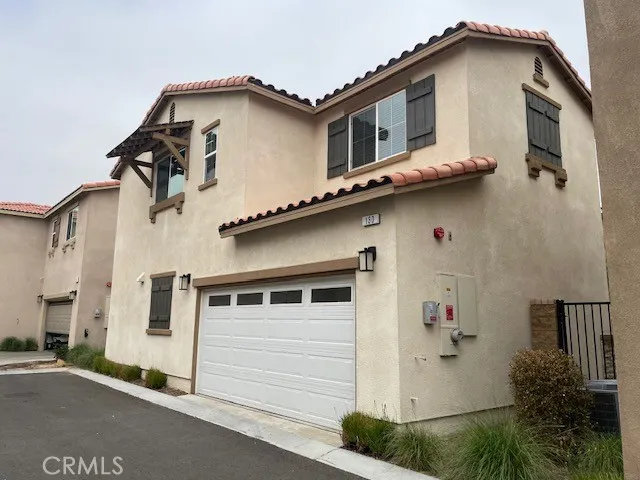 a view of a house with outdoor seating area