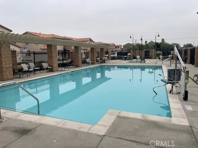 a view of a chairs and table in backyard