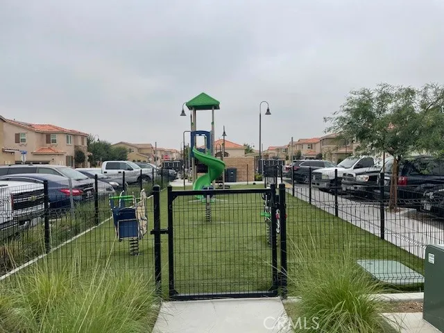 a view of a patio with chairs and a yard