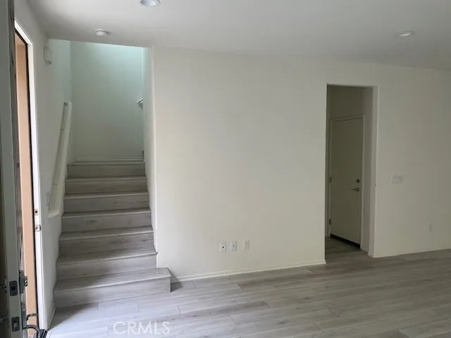 a view of an entryway with wooden floor
