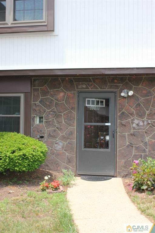 8007 Hana Road Edison, NJ 08817 - Photo 1 of 20 a front view of a house with a yard