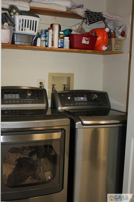 8007 Hana Road Edison, NJ 08817 - Photo 16 of 20 a close view of washer and dryer