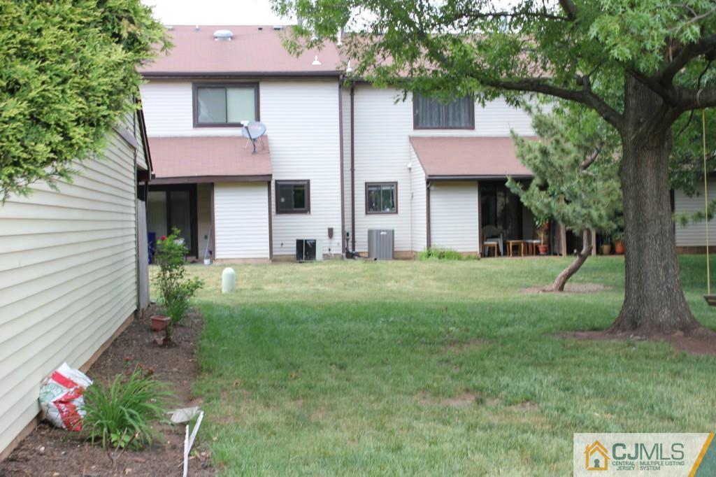 8007 Hana Road Edison, NJ 08817 - Photo 3 of 20 a front view of a house with garden