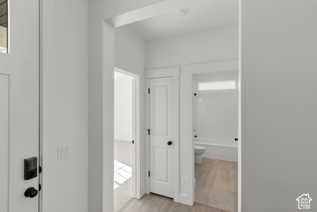205 East 690th Street North Logan, UT 84321 - Photo 9 of 52 White painted walls, wood-finish flooring, white paneled doors, and matte black hardware