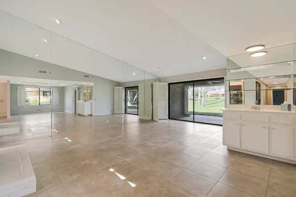 a view of an empty room with a window