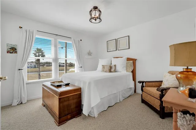 a bedroom with furniture and window