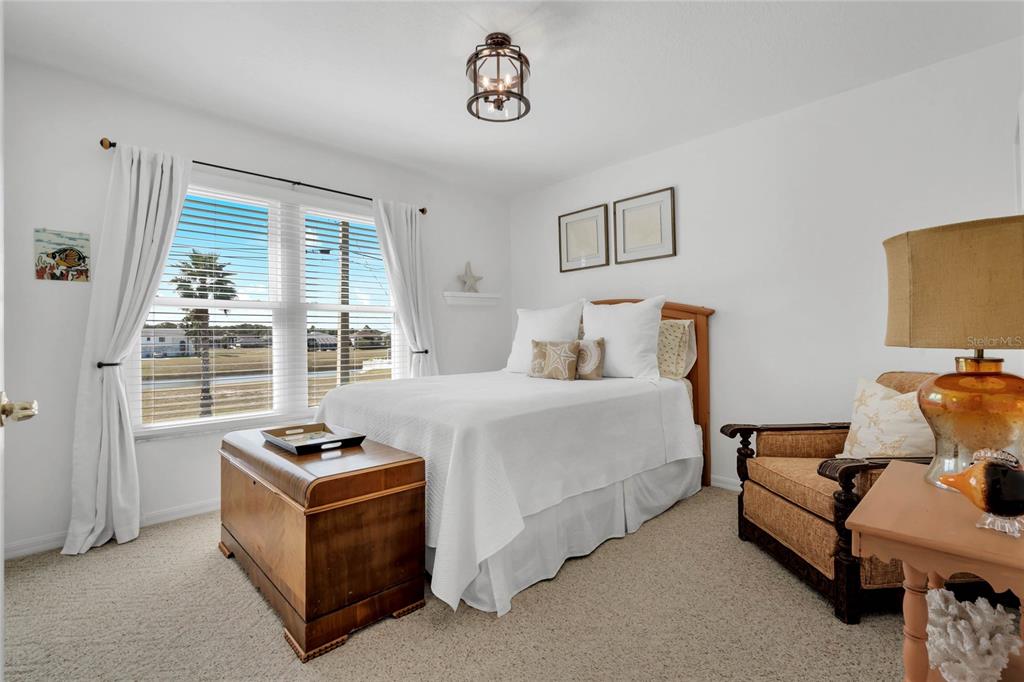 4049 Cobia Drive Hernando Beach, FL 34607 - Photo 13 of 40 a bedroom with furniture and window