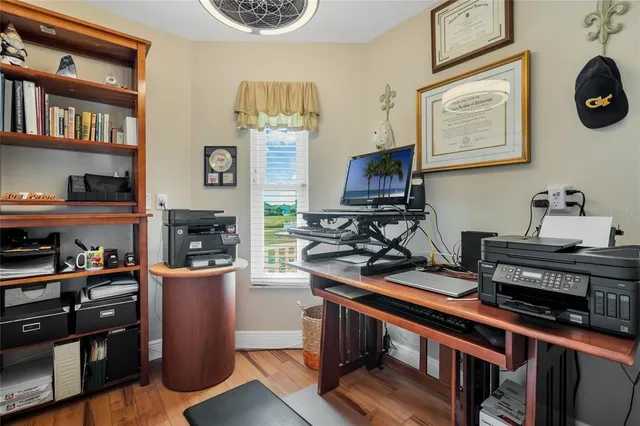 a view of a workspace with furniture and a kitchen