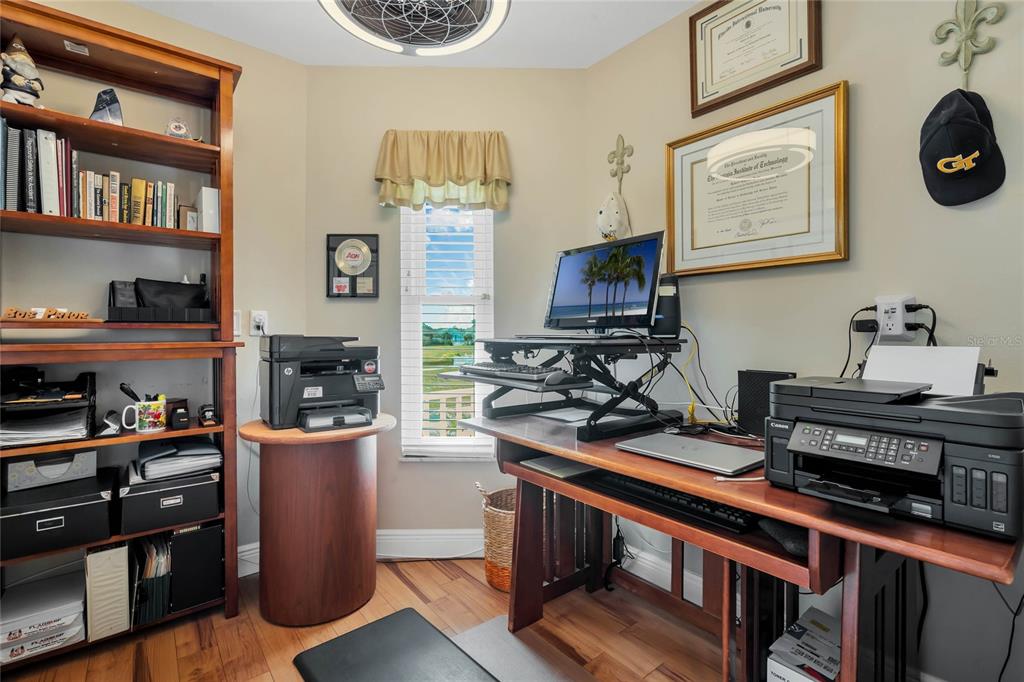 4049 Cobia Drive Hernando Beach, FL 34607 - Photo 16 of 40 a view of a workspace with furniture and a kitchen