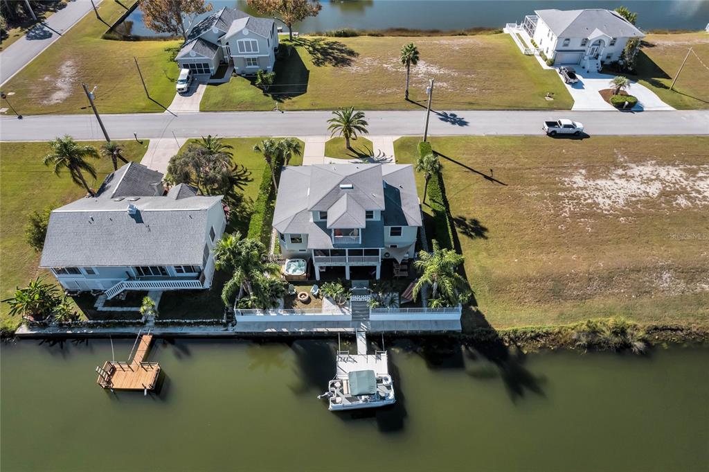 4049 Cobia Drive Hernando Beach, FL 34607 - Photo 37 of 40 an aerial view of house with yard swimming pool and outdoor seating
