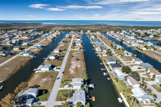 an aerial view of a house with a lake view