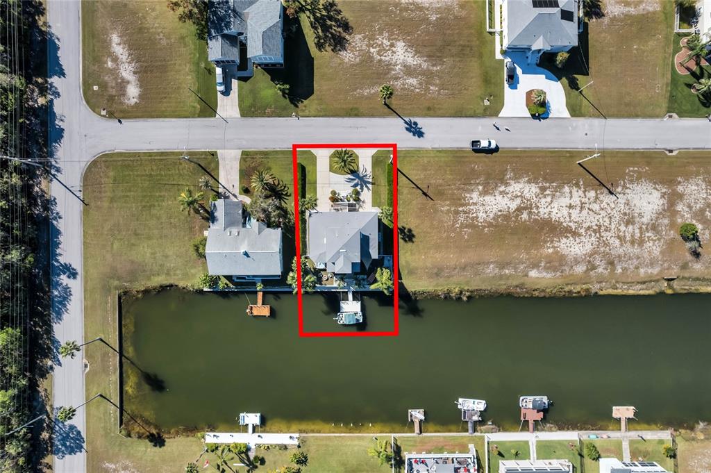 4049 Cobia Drive Hernando Beach, FL 34607 - Photo 40 of 40 an aerial view of a house with a lake view