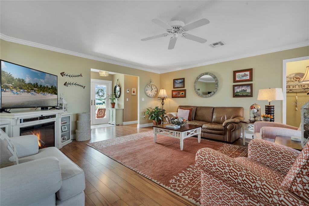4049 Cobia Drive Hernando Beach, FL 34607 - Photo 6 of 40 a living room with furniture and a flat screen tv