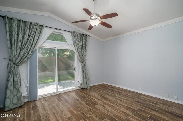a bedroom with a large bed and a large window