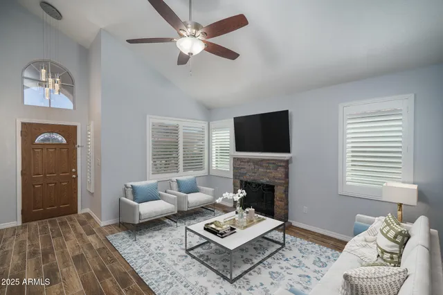 wooden floor fireplace and natural light in room
