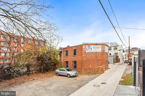 a view of a car park in front of a building