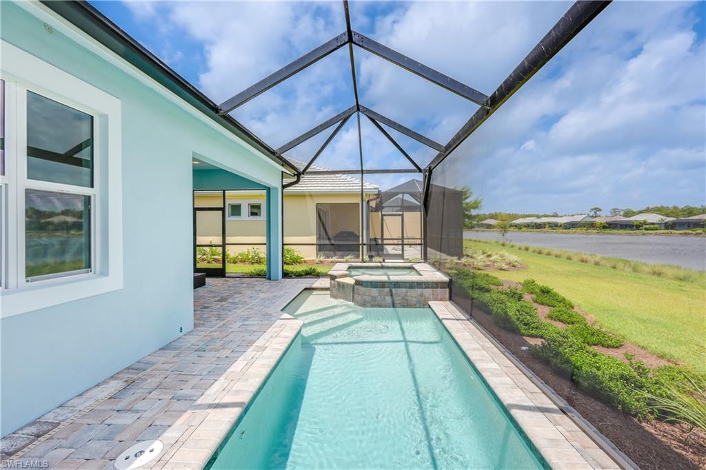 6385 Arriba Avenue Naples, FL 34113 - Photo 14 of 43 a view of swimming pool with seating area