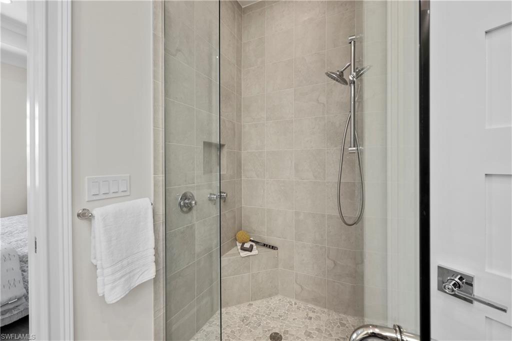 6385 Arriba Avenue Naples, FL 34113 - Photo 19 of 43 a bathroom with a shower