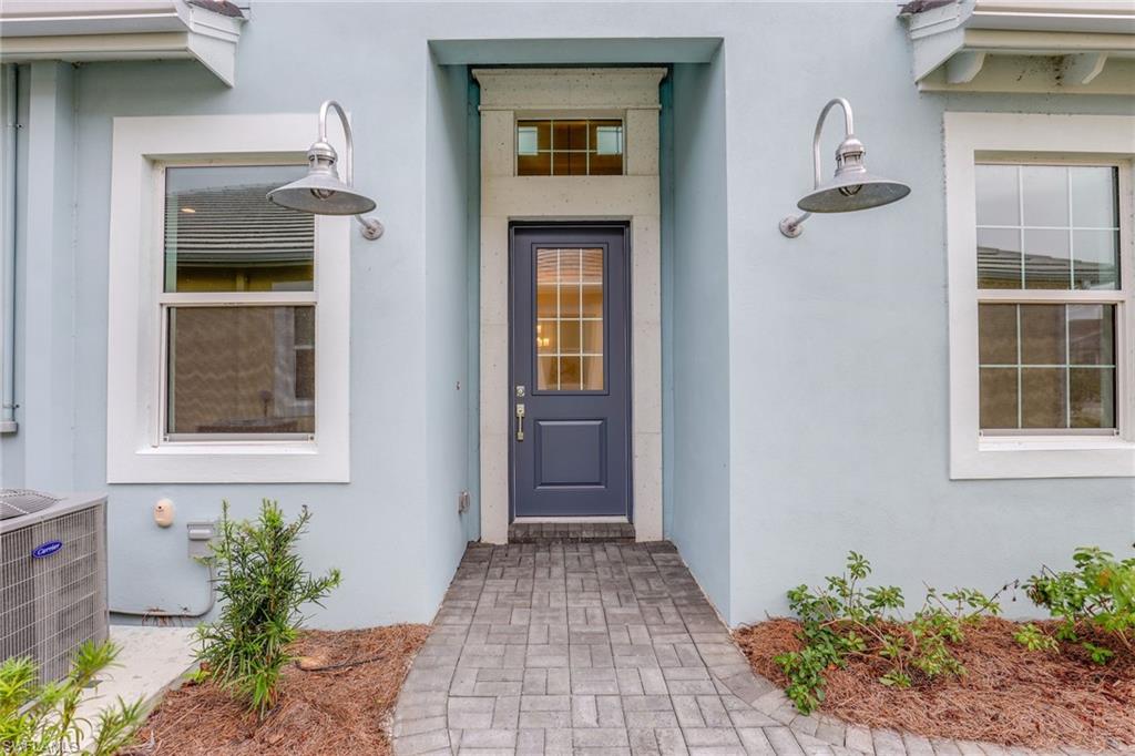 6385 Arriba Avenue Naples, FL 34113 - Photo 24 of 43 a front view of a house