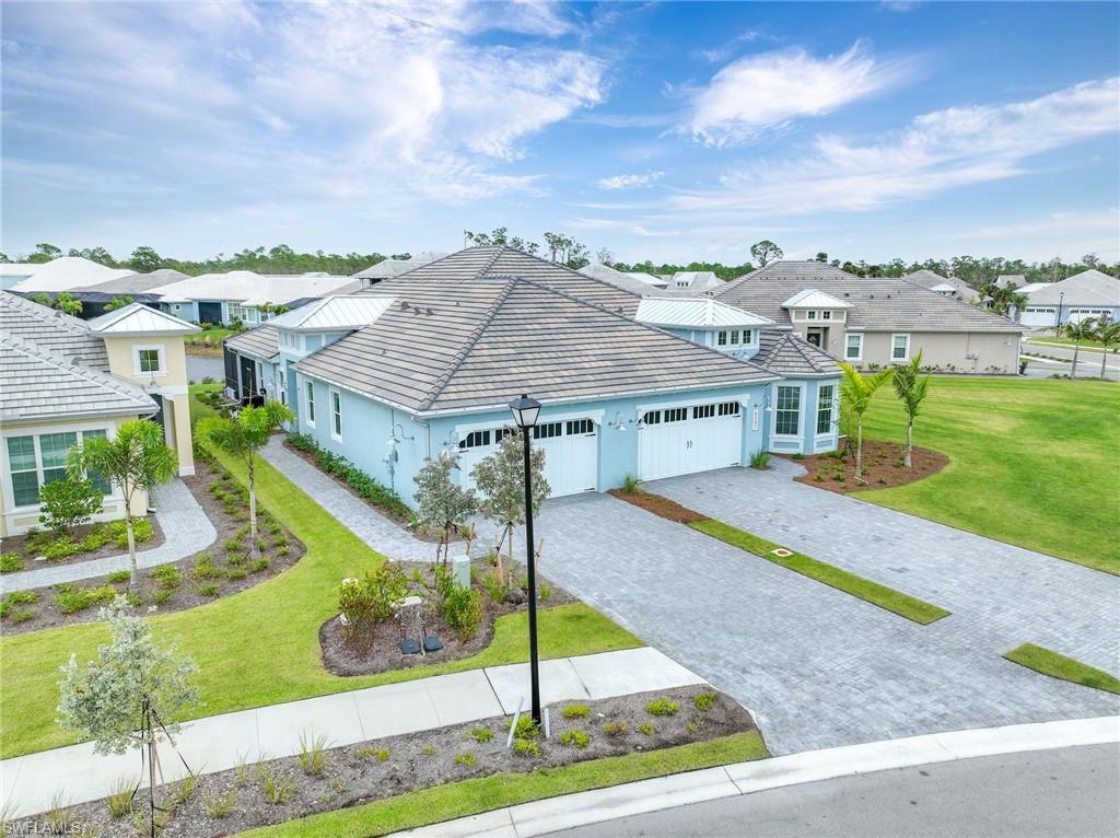 6385 Arriba Avenue Naples, FL 34113 - Photo 26 of 43 a view of a house with a yard