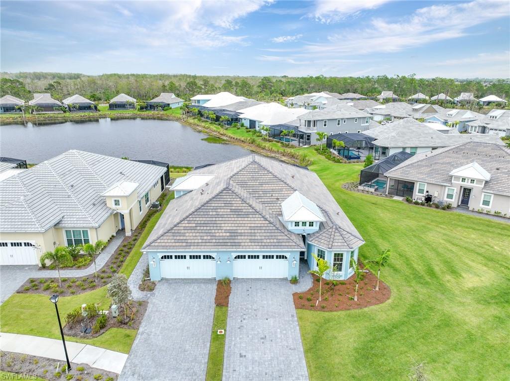 6385 Arriba Avenue Naples, FL 34113 - Photo 27 of 43 an aerial view of a house with garden space and ocean view