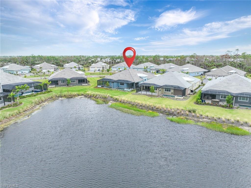 6385 Arriba Avenue Naples, FL 34113 - Photo 31 of 43 a view of swimming pool with outdoor space and lakeside