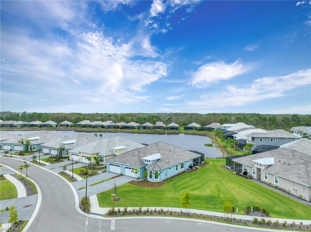 6385 Arriba Avenue Naples, FL 34113 - Photo 35 of 43 an aerial view of lake and residential houses