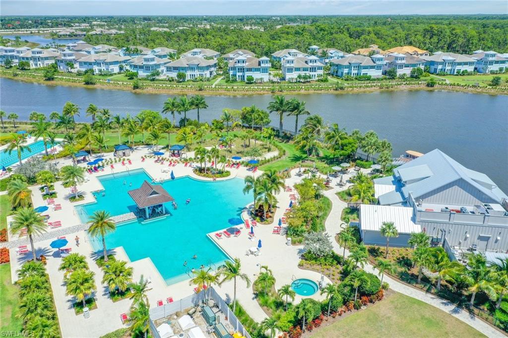 6385 Arriba Avenue Naples, FL 34113 - Photo 36 of 43 an aerial view of a city with lake view