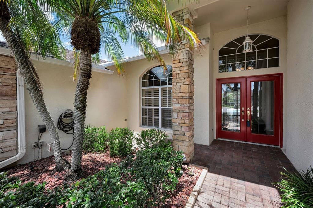 11917 Hadleigh Way Trinity, FL 34655 - Photo 5 of 84 a front view of a house with a yard