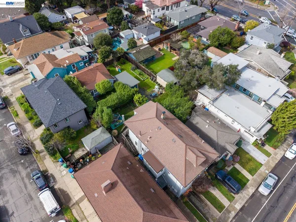 an aerial view of a house with a yard