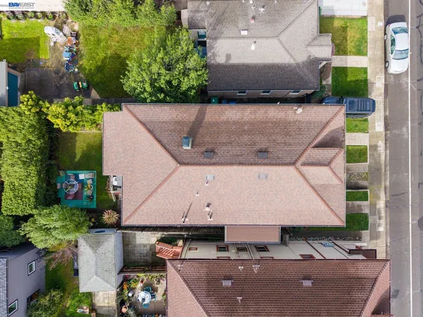 an aerial view of a house with a yard